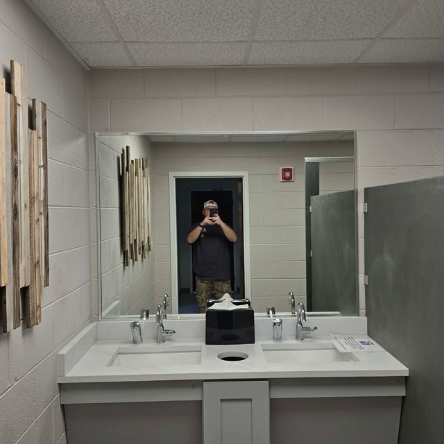 Custom bathroom mirror installation by Battlefield Glass
