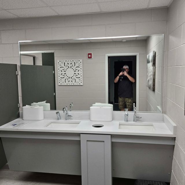 Custom bathroom mirror installation by Battlefield Glass