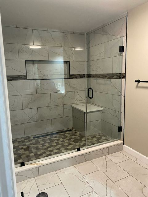 Custom glass shower enclosure installed by Battlefield Glass