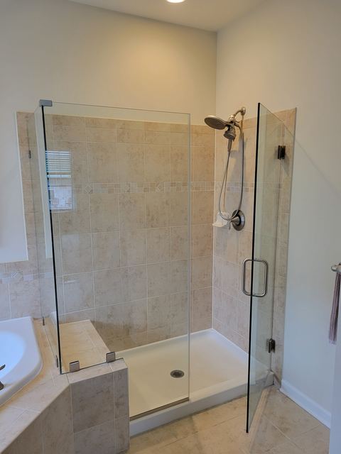 Custom glass shower enclosure installed by Battlefield Glass