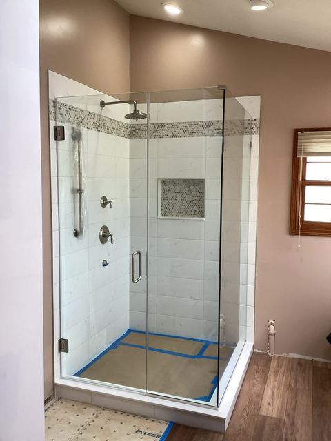 Custom glass shower enclosure installed by Battlefield Glass