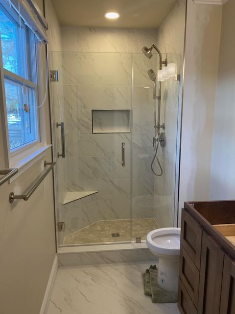 Custom glass shower enclosure installed by Battlefield Glass