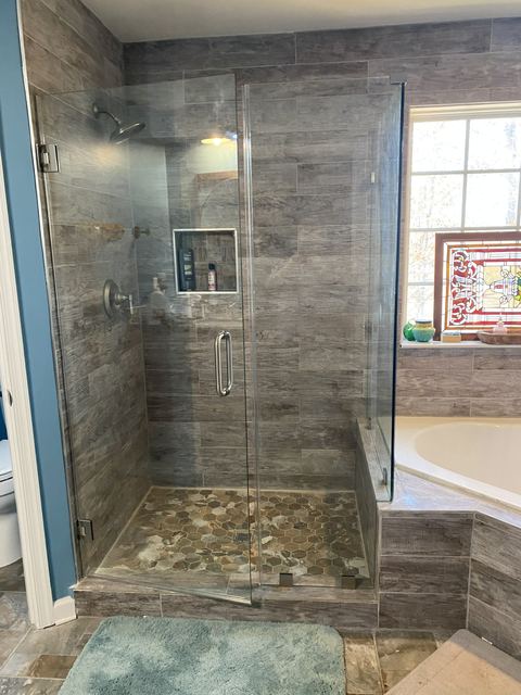 Custom glass shower enclosure installed by Battlefield Glass
