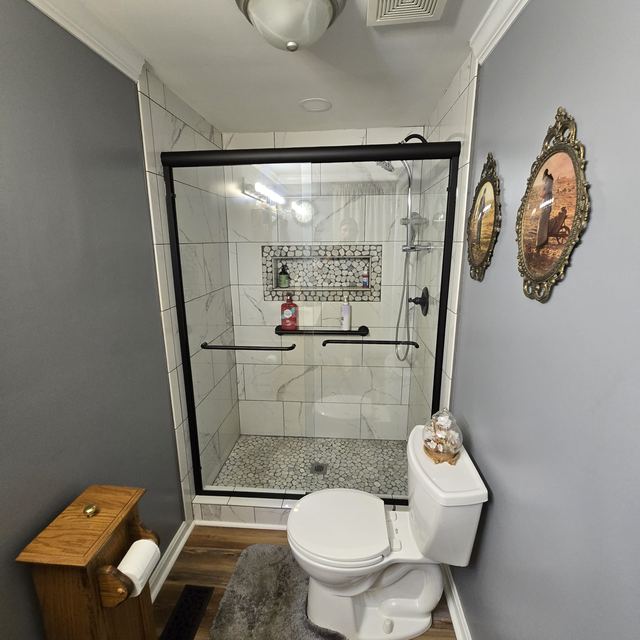 Custom glass shower enclosure installed by Battlefield Glass