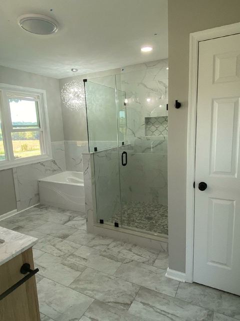 Custom glass shower enclosure installed by Battlefield Glass