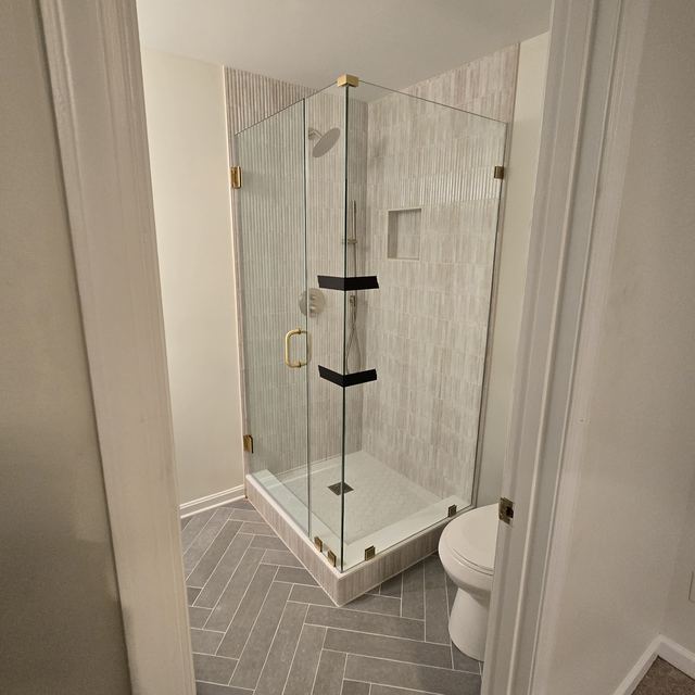 Custom glass shower enclosure installed by Battlefield Glass