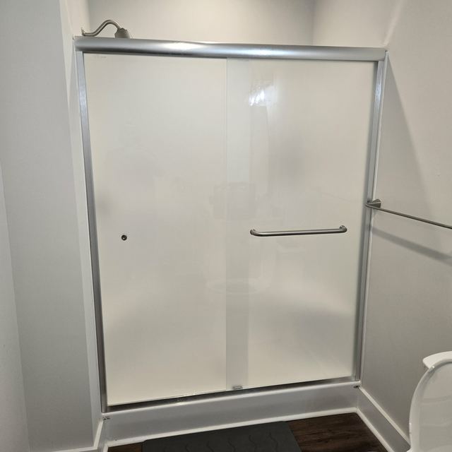 Custom glass shower enclosure installed by Battlefield Glass