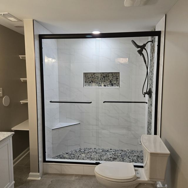 Custom glass shower enclosure installed by Battlefield Glass