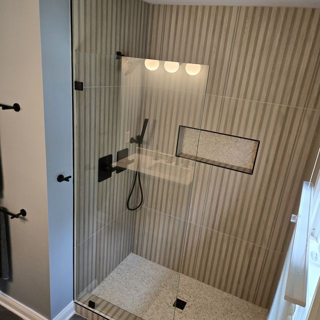 Custom glass shower enclosure installed by Battlefield Glass