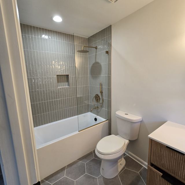 Custom glass shower enclosure installed by Battlefield Glass