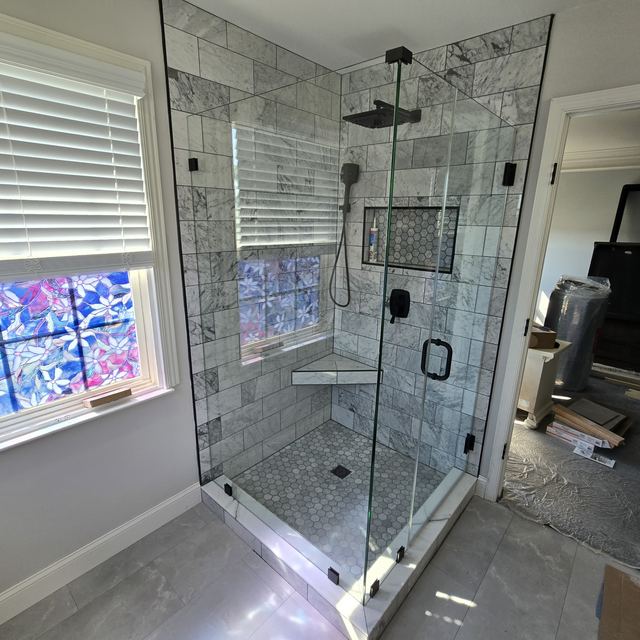 Custom glass shower enclosure installed by Battlefield Glass