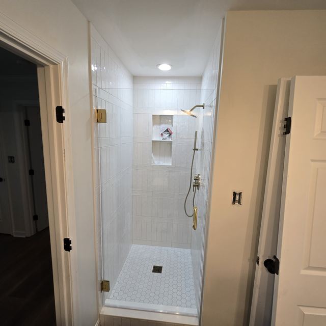 Custom glass shower enclosure installed by Battlefield Glass