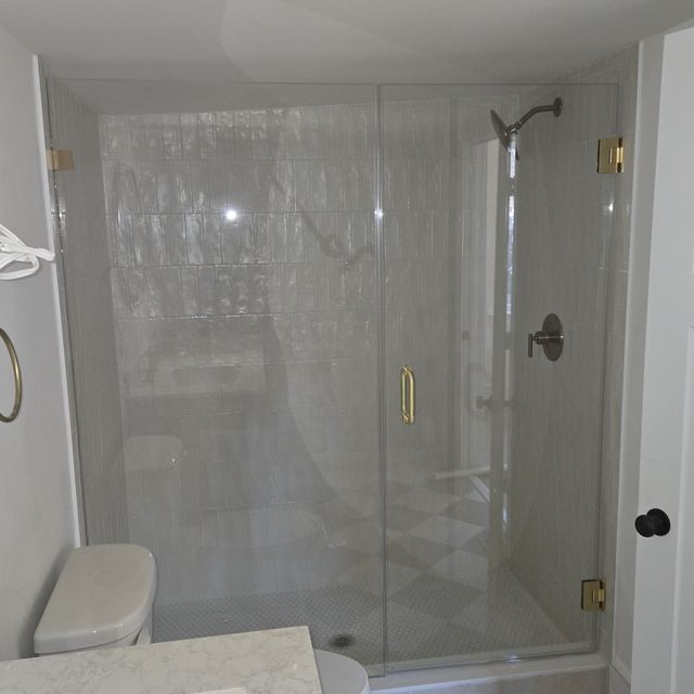 Custom glass shower enclosure installed by Battlefield Glass