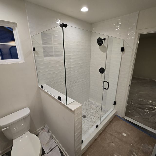Custom glass shower enclosure installed by Battlefield Glass