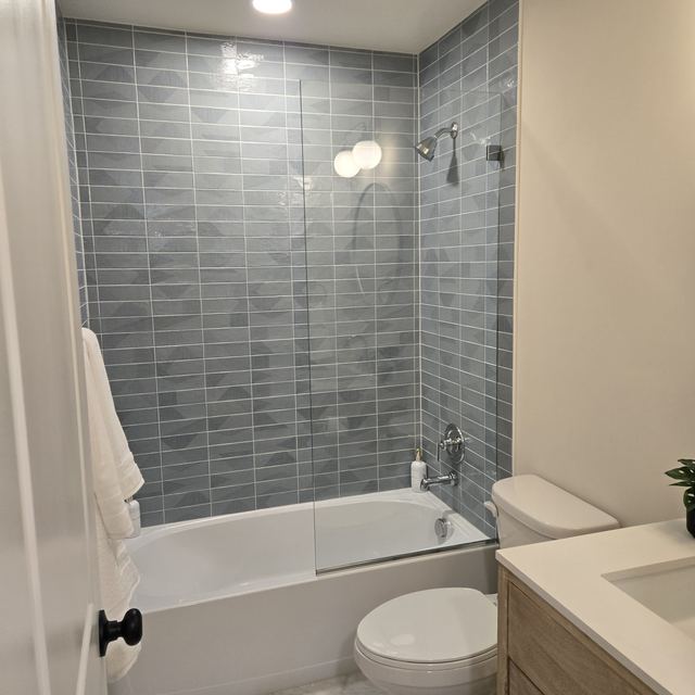Custom glass shower enclosure installed by Battlefield Glass