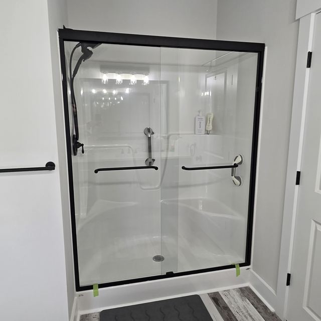 Custom glass shower enclosure installed by Battlefield Glass