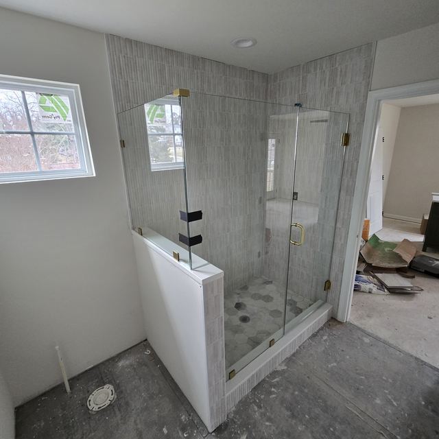 Custom glass shower enclosure installed by Battlefield Glass