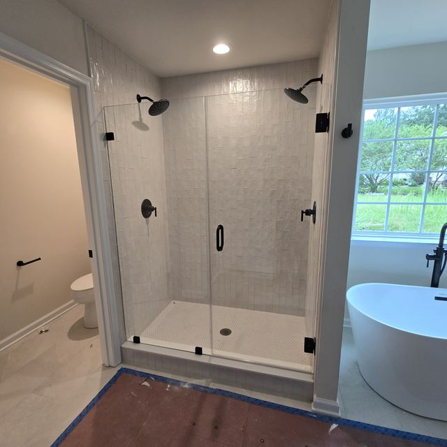 Custom glass shower enclosure installed by Battlefield Glass
