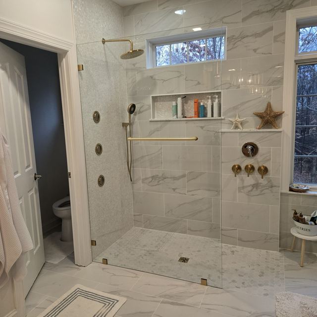 Custom glass shower enclosure installed by Battlefield Glass