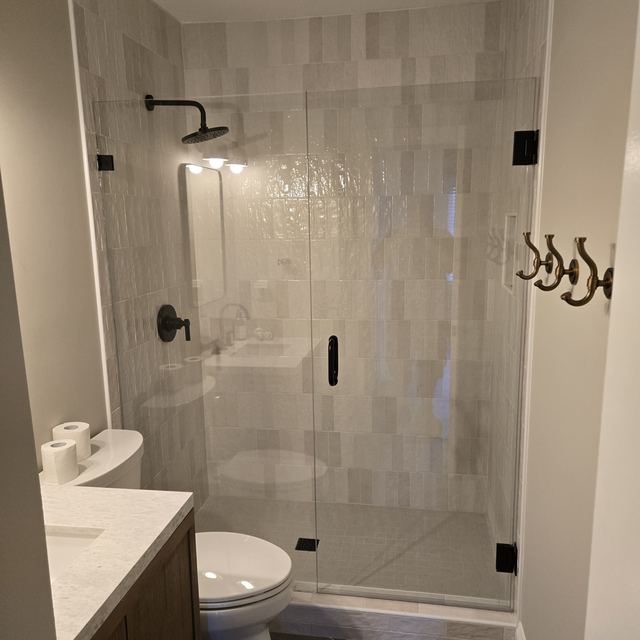 Custom glass shower enclosure installed by Battlefield Glass