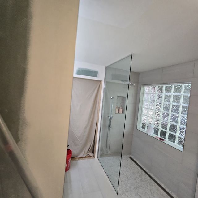 Custom glass shower enclosure installed by Battlefield Glass