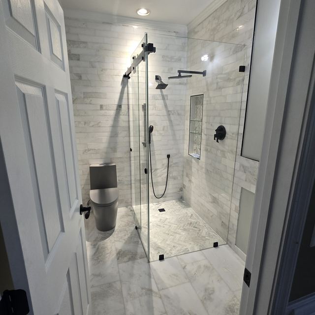 Custom glass shower enclosure installed by Battlefield Glass