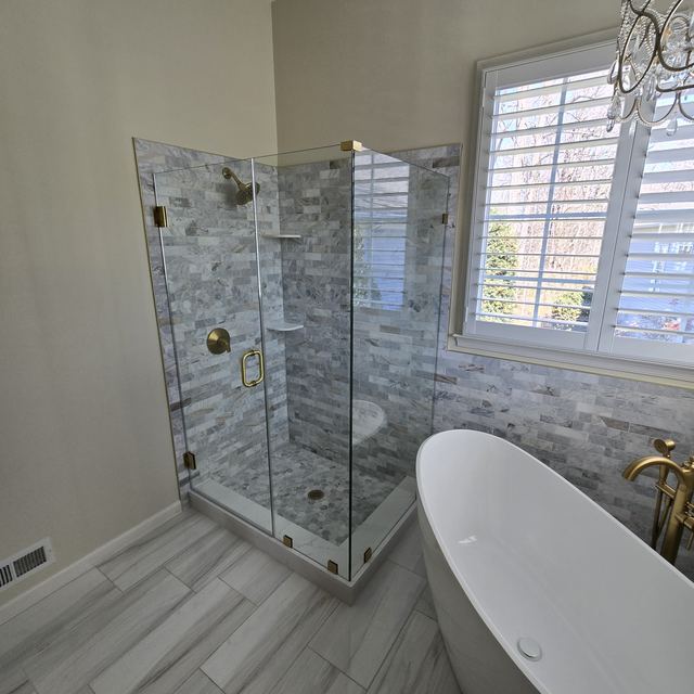 Custom glass shower enclosure installed by Battlefield Glass