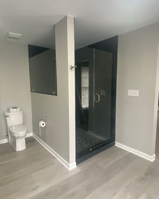 Custom glass shower enclosure installed by Battlefield Glass
