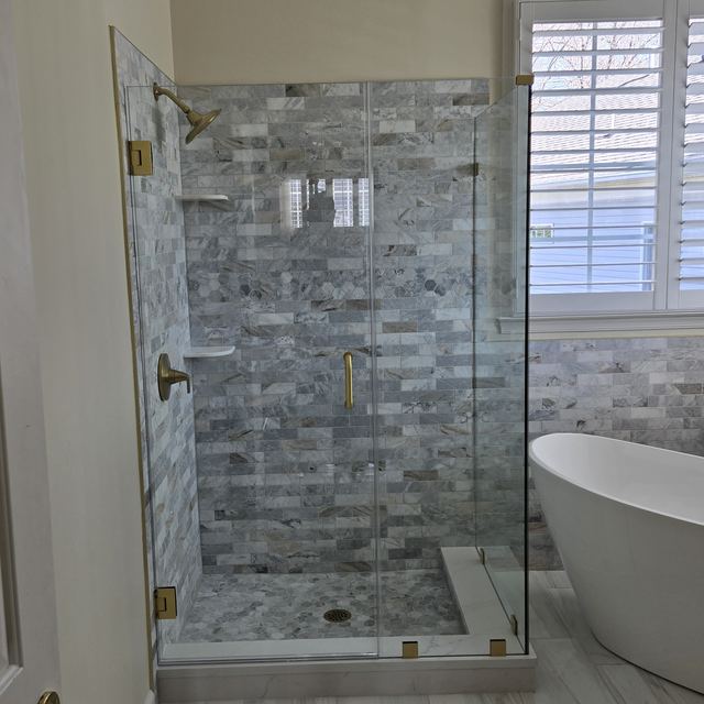 Custom glass shower enclosure installed by Battlefield Glass