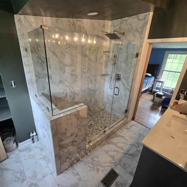 Custom glass shower enclosure installed by Battlefield Glass