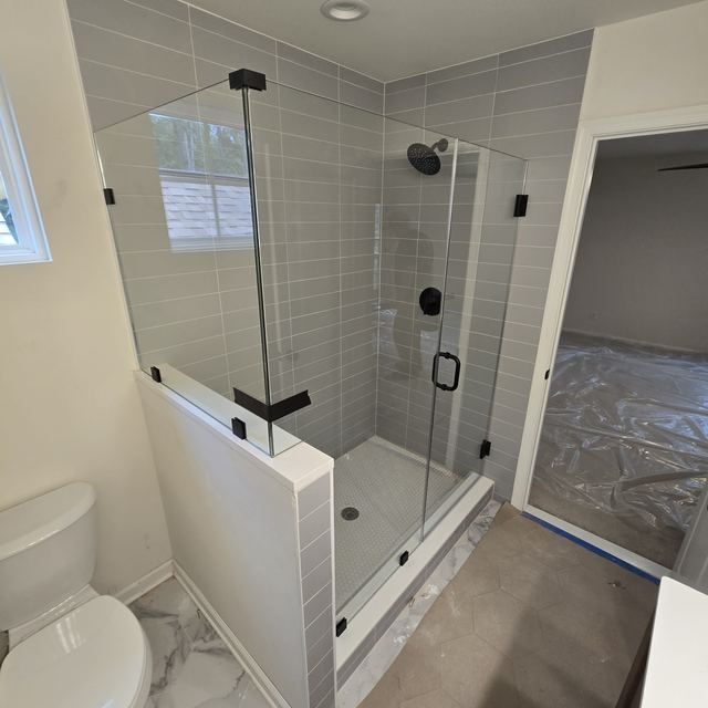 Custom glass shower enclosure installed by Battlefield Glass