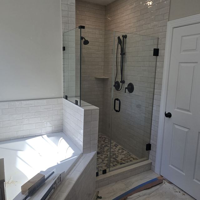 Custom glass shower enclosure installed by Battlefield Glass