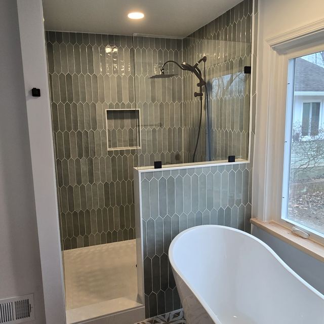 Custom glass shower enclosure installed by Battlefield Glass