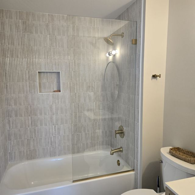 Custom glass shower enclosure installed by Battlefield Glass