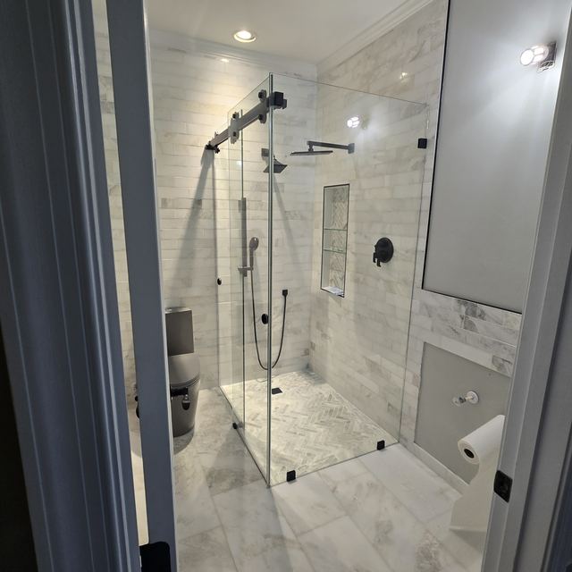 Custom glass shower enclosure installed by Battlefield Glass