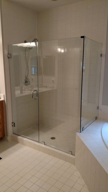 Custom glass shower enclosure installed by Battlefield Glass