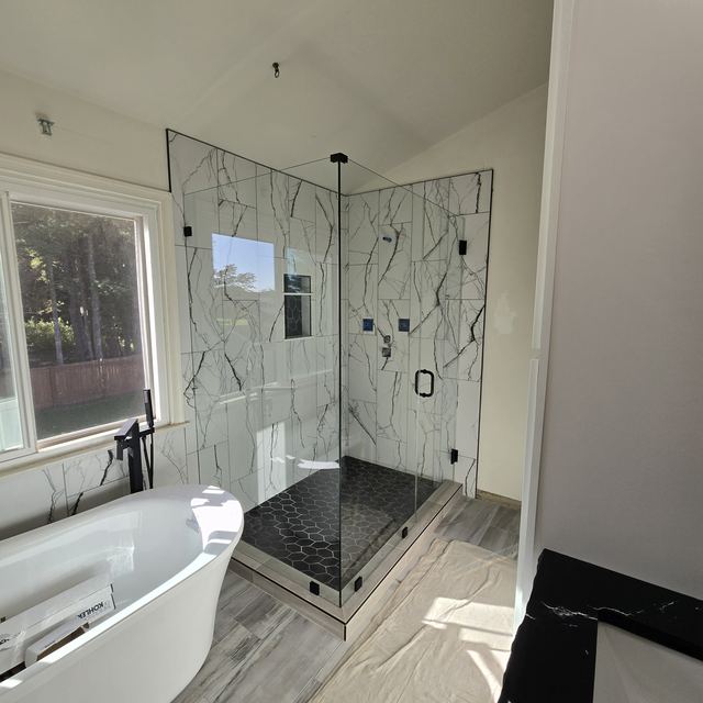 Custom glass shower enclosure installed by Battlefield Glass