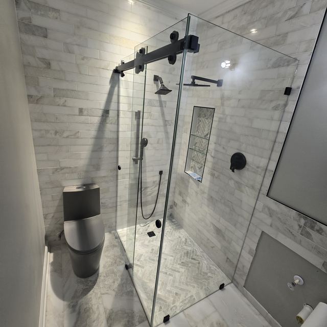 Custom glass shower enclosure installed by Battlefield Glass