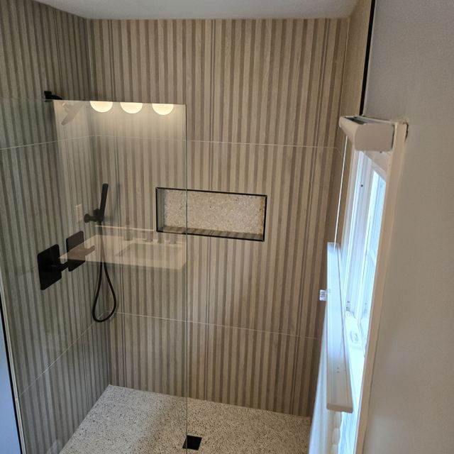 Custom glass shower enclosure installed by Battlefield Glass
