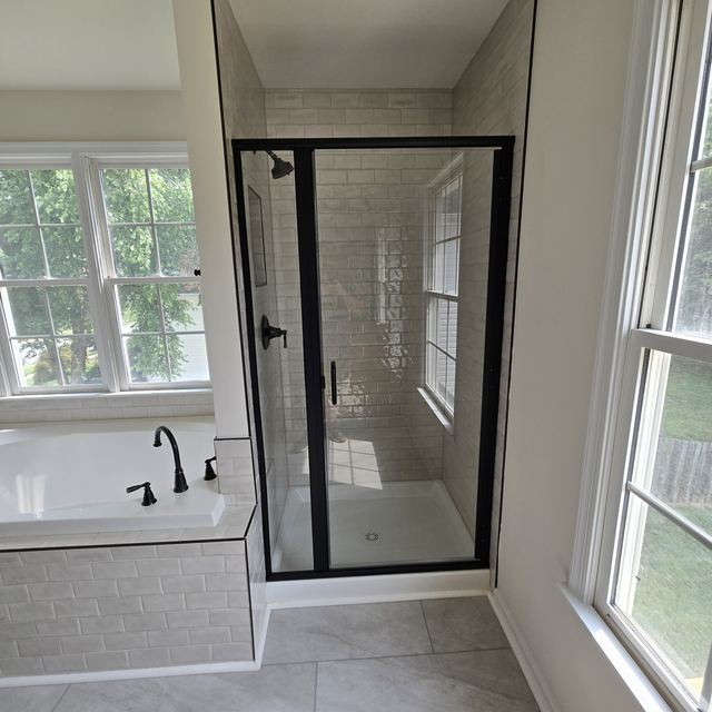 Custom glass shower enclosure installed by Battlefield Glass