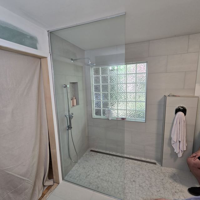 Custom glass shower enclosure installed by Battlefield Glass