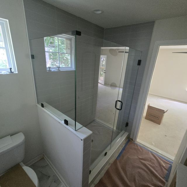 Custom glass shower enclosure installed by Battlefield Glass