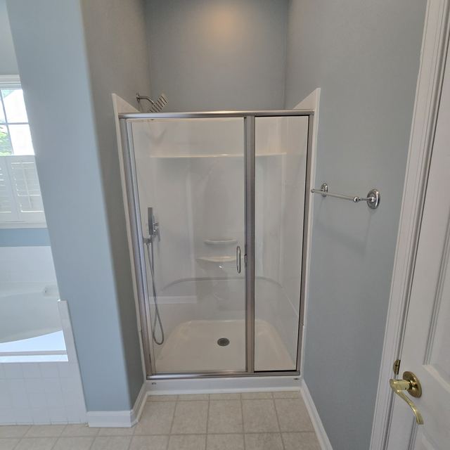 Custom glass shower enclosure installed by Battlefield Glass