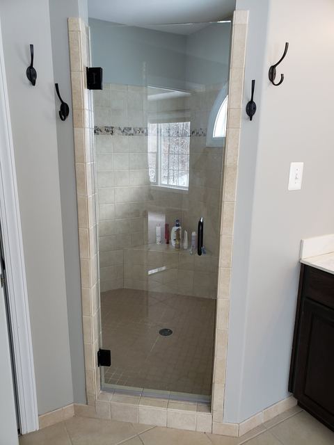 Custom glass shower enclosure installed by Battlefield Glass