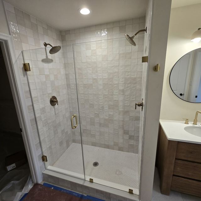 Custom glass shower enclosure installed by Battlefield Glass