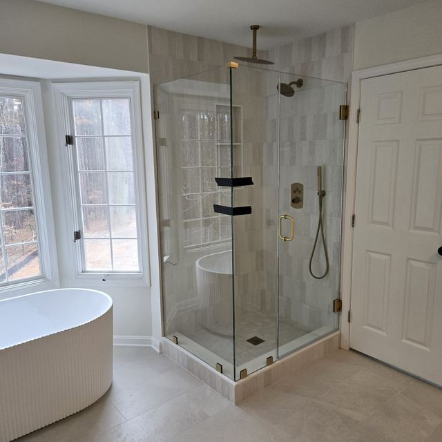 Custom glass shower enclosure installed by Battlefield Glass