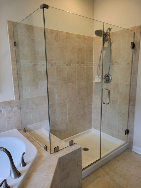 Custom glass shower enclosure installed by Battlefield Glass