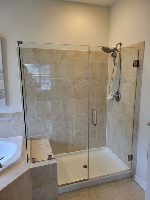 Custom glass shower enclosure installed by Battlefield Glass