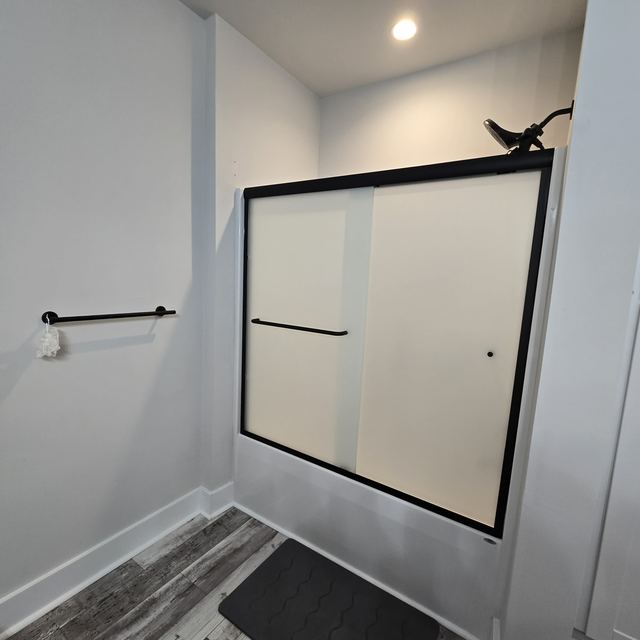Custom glass shower enclosure installed by Battlefield Glass