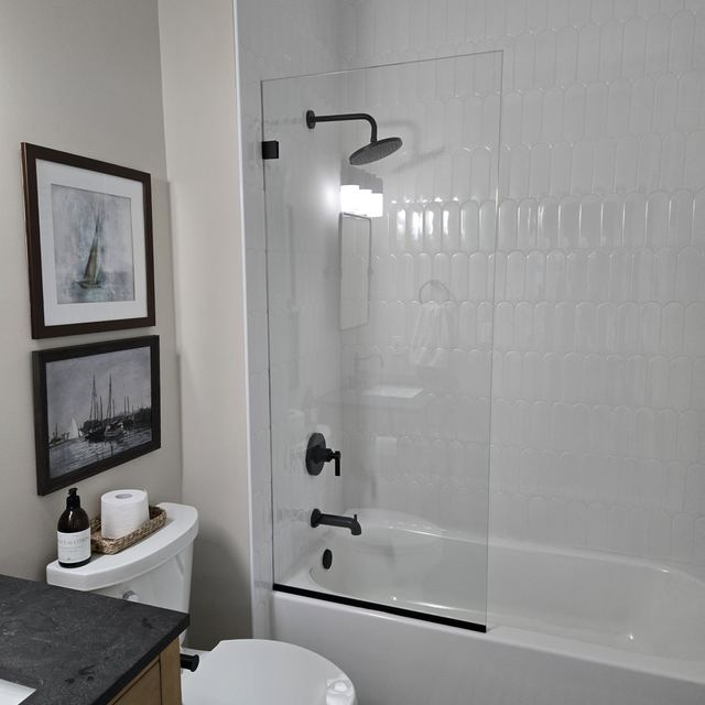 Custom glass shower enclosure installed by Battlefield Glass